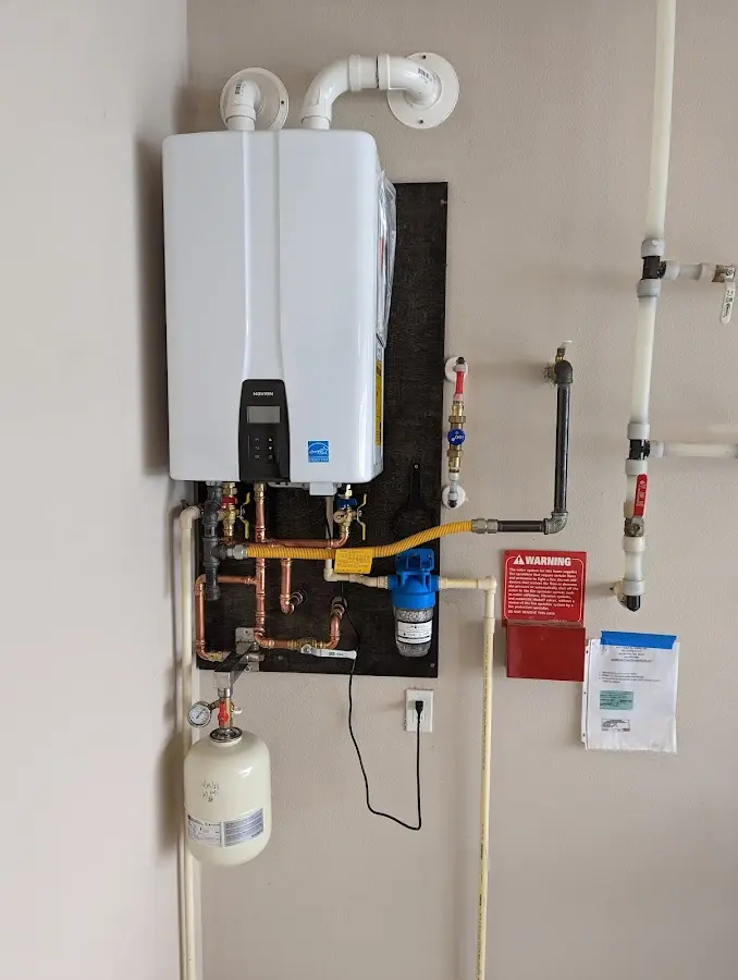 Professional plumber installing copper piping in a Victoria home